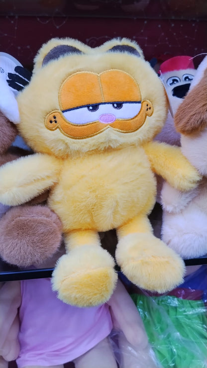 Yellow teddy bear held in hand for size reference